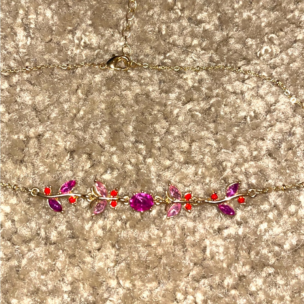 Fancy gold necklace with pink and purple jewels